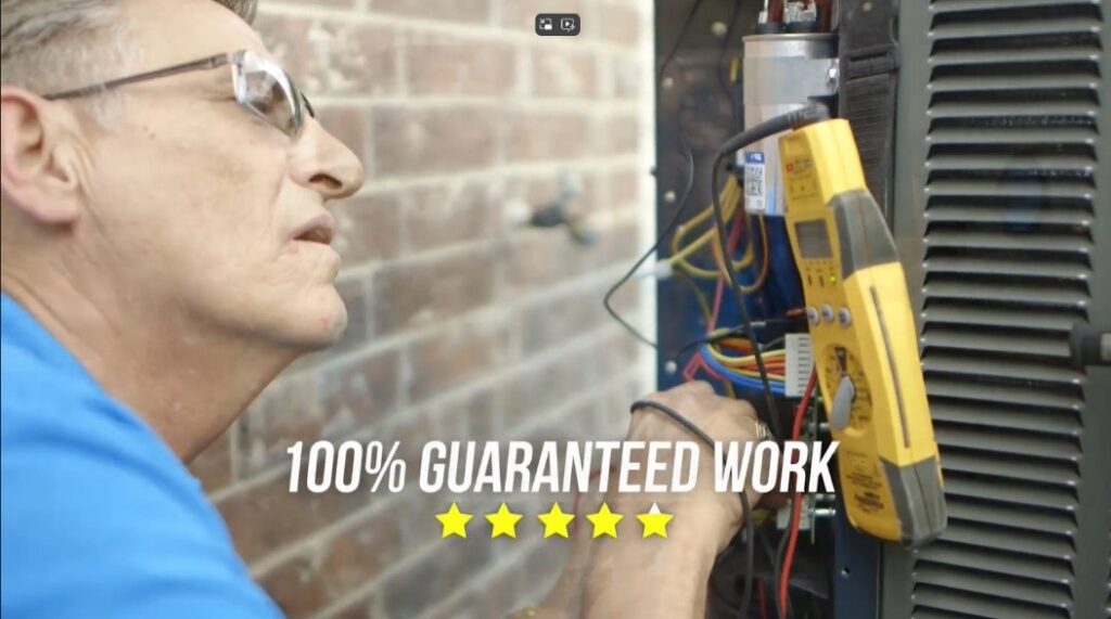 A man is working on an air conditioner.